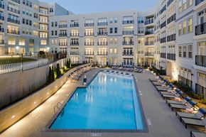 Raleigh apartment for rent - a large swimming pool in front of an apartment building