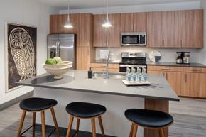 Raleigh apartment for rent - a kitchen with a center island with three stools