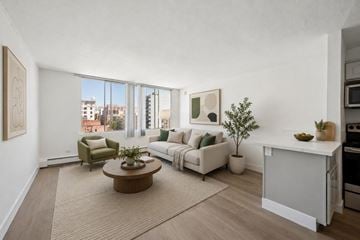 San Francisco apartment for rent - A living room with a brown coffee table and white couches.