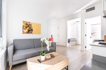 Emeryville apartment for rent - A living room with a grey couch and a wooden coffee table.