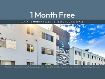 Oakland apartment for rent - A building with a sign that says "1 Month Free on a 12-month lease | $500 look & lease".