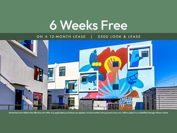 Oakland apartment for rent - A colorful mural on a building with the text "6 Weeks Free on a 12-month lease | $500 look & lease" displayed.