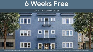 Oakland apartment for rent - A blue building with the text "6 Weeks Free on a 13-month lease" displayed on it.