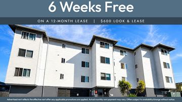Oakland apartment for rent - A modern apartment building advertises a 6 weeks free offer on a 12-month lease.