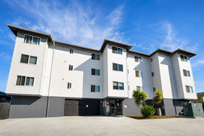Oakland apartment for rent - A modern apartment building with a black and white exterior.