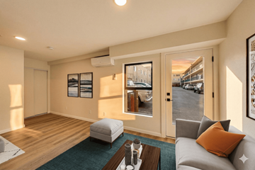 Oakland apartment for rent - A living room with a grey couch and a coffee table.