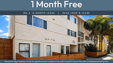 Oakland apartment for rent - A building with the text "1 Month Free on a 12-month lease | $600 Look & Lease" displayed on it.