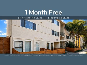 Oakland apartment for rent - A building with a sign that says "1 Month Free on a 12-month lease | $600 look & lease".