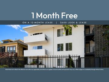 Oakland apartment for rent - Apartment complex with a sign offering a free month on a 12-month lease.