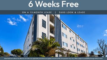 Oakland apartment for rent - A building with a sign that says "6 Weeks Free on a 13-month lease | $600 look & lease".