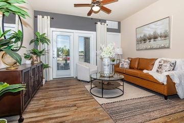 Loveland apartment for rent - A living room with a brown leather couch and a coffee table.