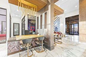 Las Vegas apartment for rent - A modern dining area with a long table and chairs.