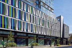 Oakland apartment for rent - A modern building with a glass facade and a sign that says "Retail Space Available".