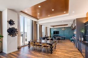 Oakland apartment for rent - A modern dining room with a wooden table and chairs.