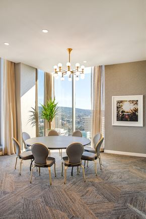 Oakland apartment for rent - A dining room with a table and chairs and a view of the city.