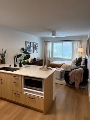 Seattle apartment for rent - Open concept studio with kitchen island and living area at Noda Apartments, Seattle, WA 98101