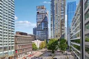 Seattle apartment for rent - A cityscape with tall buildings and a clear sky.