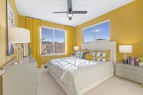Las Vegas apartment for rent - A bedroom with a bed, nightstands, and a ceiling fan.