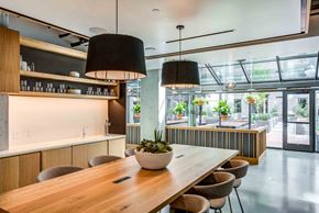 San Francisco apartment for rent - A modern dining area with a long wooden table and chairs.
