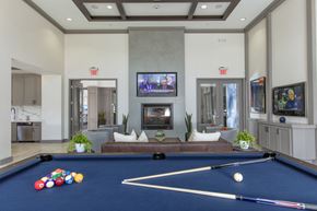 Ontario apartment for rent - Clubroom with seating area and fireplace at The Grove Apartments, California