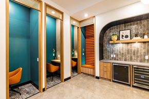 Oakland apartment for rent - a conference room with blue walls and orange chairs