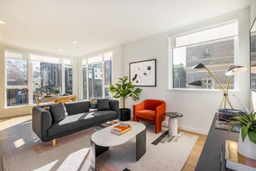 Oakland apartment for rent - a living room with a couch and a coffee table and large windows