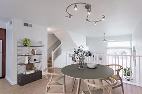 Roseville townhouse for rent - A dining area with a round table and chairs.
