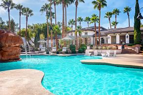 Las Vegas apartment for rent - Spring Valley Apartments - Alicante - Pool with White Lounge Chairs, Palm Trees, Umbrella Tables, and View of Sundeck
