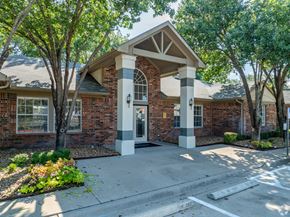 Killeen apartment for rent - A brick building with a white door and pillars.