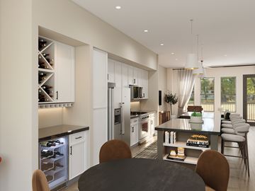Mckinney apartment for rent - A modern kitchen with a dining table and chairs.