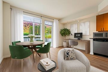 Seattle apartment for rent - A modern living room with a dining table and chairs.