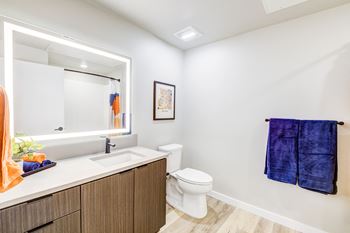 Illuminated bathroom mirror