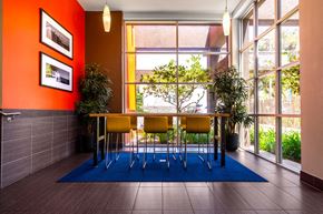 Valley Village apartment for rent - a dining room with a table and chairs in front of a window