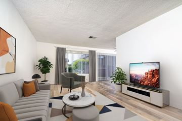 West Covina apartment for rent - a living room with a couch and a table
