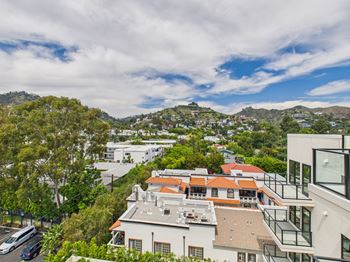 A view of a residential area with houses and trees.