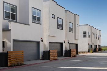 Attached 2 car garage & parking with each home (equipped to install ev charging 220v outlet)*