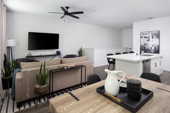 Upgraded lighting  with black fixtures and ceiling fans