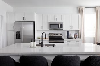 Quartz countertops in kitchen and bath