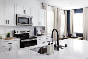 Quartz countertops in kitchen and bath
