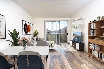 Valley Village apartment for rent - a living room with a white table and a tv