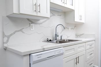 Modern kitchen with gas stove and built- in microwave