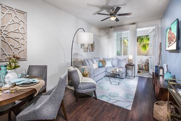 Chino Hills apartment for rent - a living room with couches and a table and a ceiling fan
