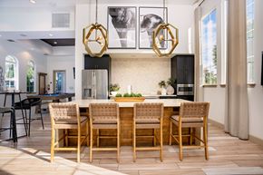 Chino Hills apartment for rent - A modern dining room with a wooden table and chairs at Capriana at Chino Hills, California, 91709