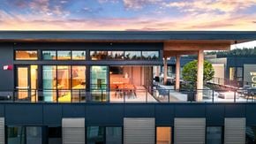 Redmond townhouse for rent - A modern building with a balcony and a view of the sky.