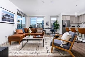 Redmond townhouse for rent - A living room with a brown sofa and a black coffee table.