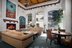 Scottsdale apartment for rent - A living room with a fireplace and a couch.