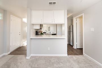 Scottsdale apartment for rent - A kitchen area with white cabinets and appliances.