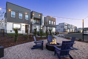 Lincoln apartment for rent - an outdoor patio with chairs and a fire pit at dusk
