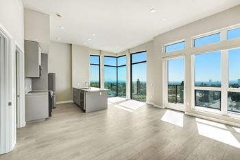 A spacious kitchen with a view of the city.