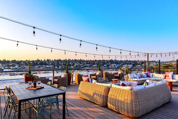Rooftop lounge with lake views and lounge chairs